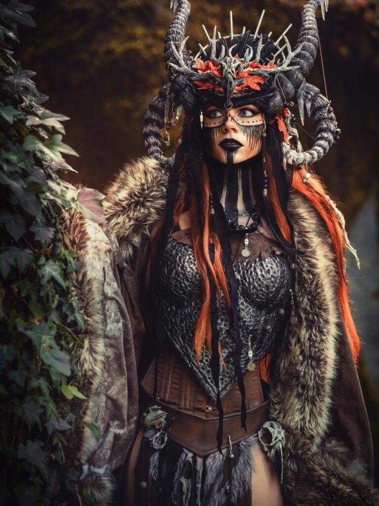 Explore the breathtaking “Fall Oracle” cosplay by Cinderys, featuring a dramatic headpiece, detailed costume work, and enchanting fall-inspired visuals.